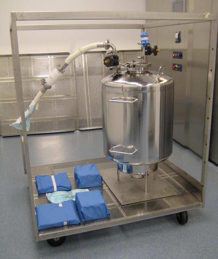 Stainless-steel vessel, connected tubing, and wrapped equipment components arranged on a cart for steam sterilization load-development evaluation.