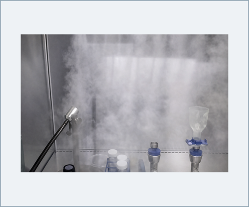 Parallel smoke streams demonstrating downward unidirectional airflow and first-air protection within the critical processing zone.
